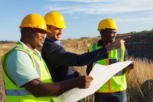 mine manager and workers at quarry discussing future plan