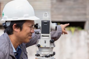 an engineer performing boundary surveys