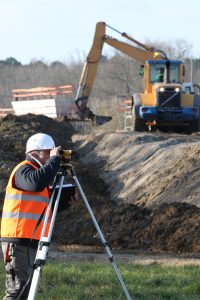 A land surveyor using an altometer