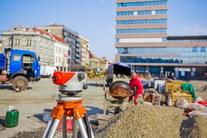 Surveying measuring equipment at construction building site