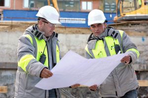 engineers looking over a construction survey