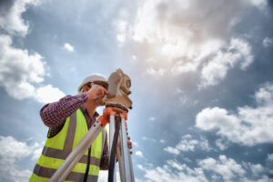 Surveyor equipment. Surveyor’s telescope at construction site or Surveying for making contour plans are a graphical representation of the lay of the land before startup construction work